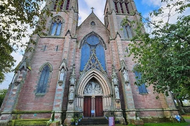 Front facade of Inverness Cathedral with intricate stone carvings and stained glass windows